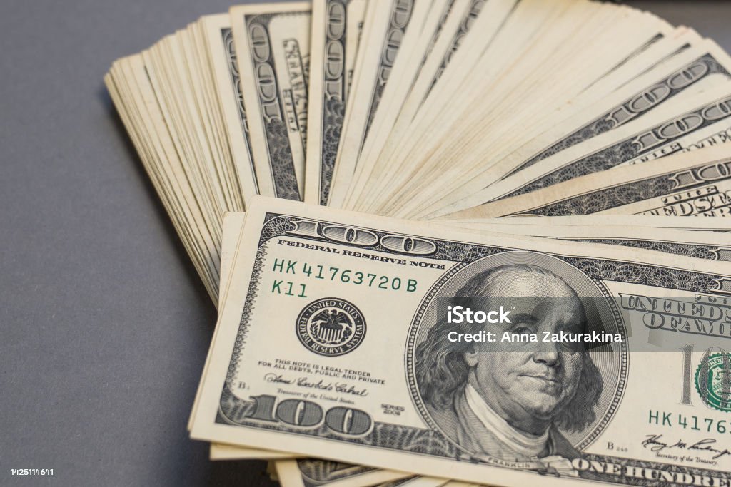 close up of a pile of banknotes, American dollar stack, pack of money, rich, luxury, spending money in crisis, benchmark currency, most used in transactions across the world, corruption, millionaire US Currency Stock Photo
