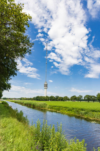 Landscape with transmission tower Smilde The Netherlands Landscape with Beilervaart and transmission tower Smilde in the backgroundThe Netherlands hoogersmilde stock pictures, royalty-free photos & images