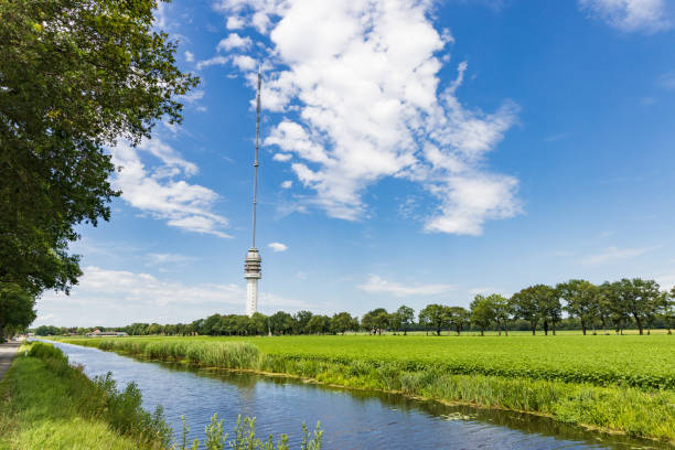 Landscape with transmission tower Smilde The Netherlands Landscape with Beilervaart and transmission tower Smilde in the backgroundThe Netherlands hoogersmilde stock pictures, royalty-free photos & images
