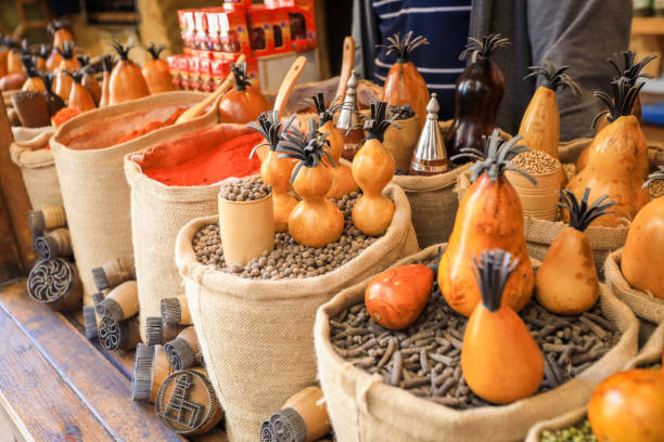 Wooden Uzbek Souvenirs on the Bags of Spices in the local Market of Bukhara stock photo
