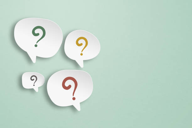 istock multicolor question marks on speech bubbles paper cut with grunge green background for FAQ, support center concept 1425120396