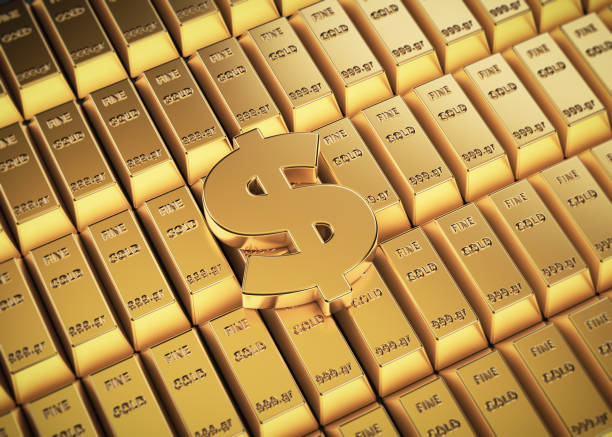 istock Dollar sign on rows of gold ingots 1425120528