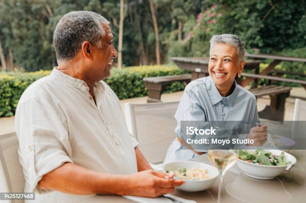 Retirement Health And Fine Dining With Elderly Couple On Vacation Holiday Or Getaway Together Food Love And Happy Old Age Man And Woman Eating Lunch In Restaurant And Enjoying Bonding Time Stock Photo - Download Image Now