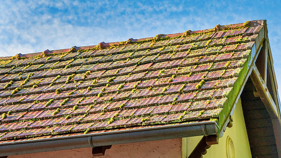 On newly constructed home, overlapping asphalt shingles are seen on roof