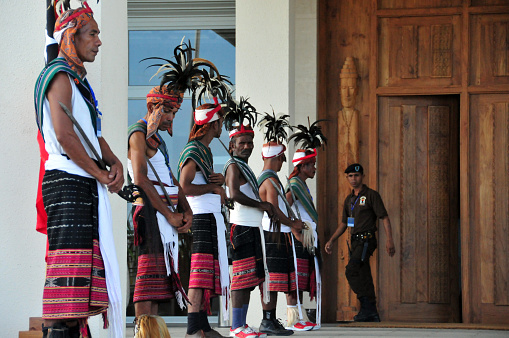 Dili, East Timor / Timor Leste: tribal guard lined at the Nicolau Lobato Presidential Palace. Soldiers wearing ceremonial attire, traditional skirts, sashes and feathered hats.
