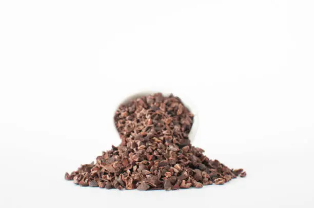 Great chocolate chip replacement and rich antioxidants super food isolated on white background.