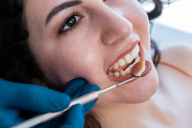 istock Woman Having Teeth Examined 1425133039