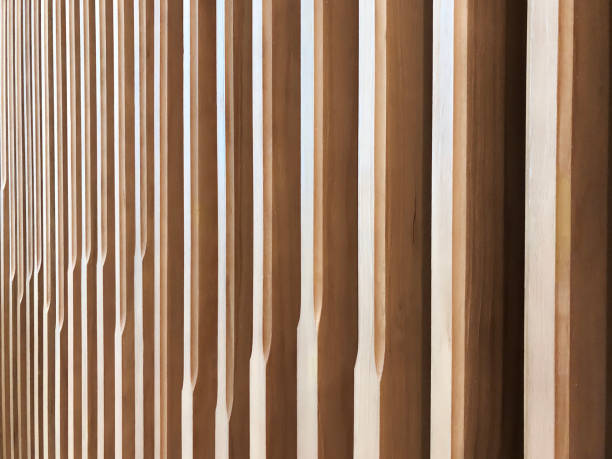 istock Beautiful abstract pattern of light color wood vertical stripe in angle with edge beveled in random rhythm 1425133695