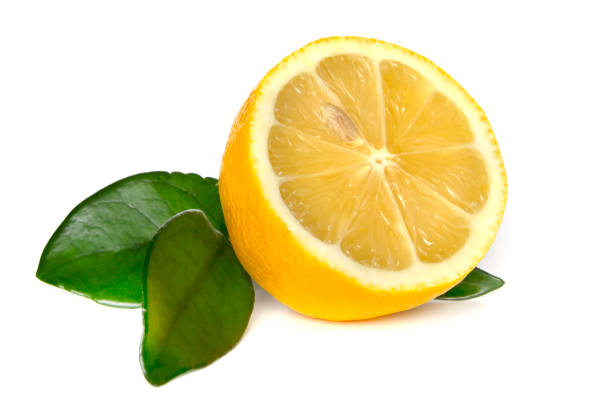 istock Half of fresh lemon with leaves isolated on white background 1425133737