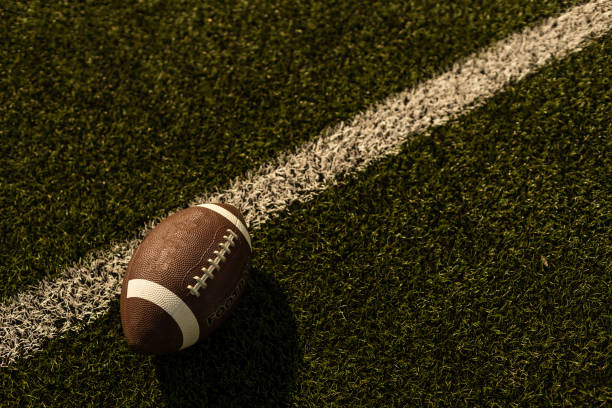 American football on football field background stock photo