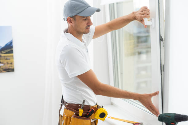 istock Master's work. Close-up of young handyman setting new windows at the appartment 1425133934