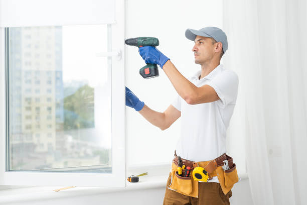 istock Using drill by installing windows. Repairman is working indoors in the modern room 1425134592