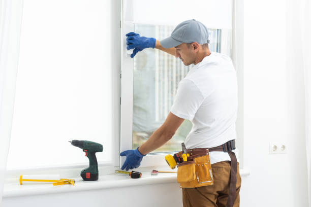 istock Master in gloves adjusting pvc windows with screwdriver closeup. Installation of plastic windows repair and maintenance concept. 1425134643