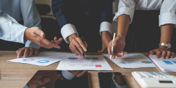 istock Business team hands at working with financial plan, meeting, discussion, brainstorm with tablet on office desk, Meeting concept. 1425135393