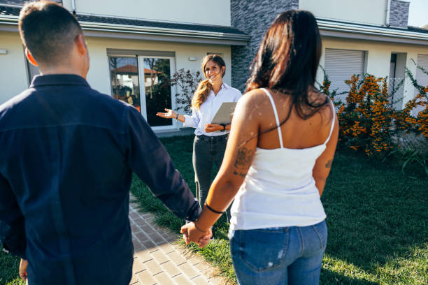 istock Couple visiting a new property for sale 1425136202