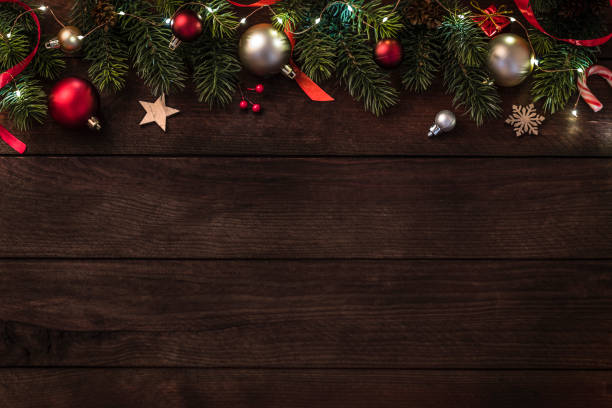 istock Christmas ornaments with copy space on a wooden table 1425136409