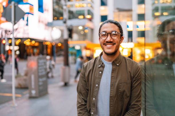 istock Happy man in city looking at camera. 1425136572