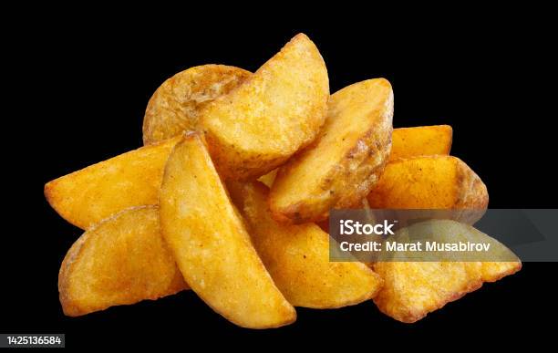 Delicious Fried Potato Wedges On Black Stock Photo - Download Image Now - Baked, Black Background, Black Color