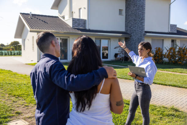 istock Couple visiting a new property for sale 1425137787