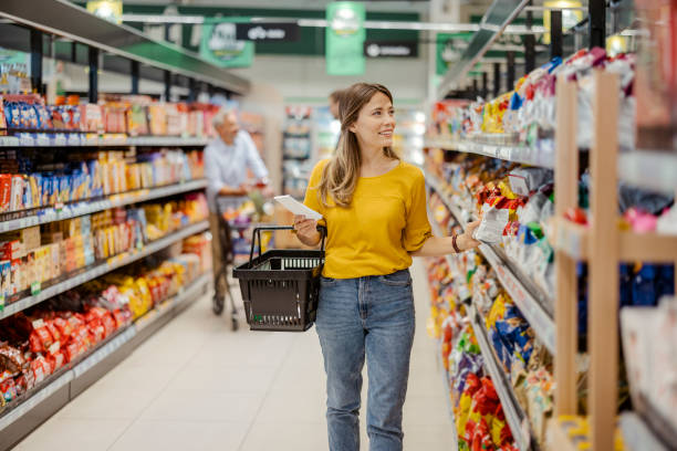 istock Women Purchasing Goods at Grocery Store 1425138178