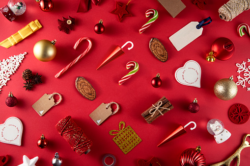 Christmas related objects and ornaments on red background