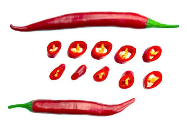 istock Red chopped chili peppers on white background. Top view. 1425143144