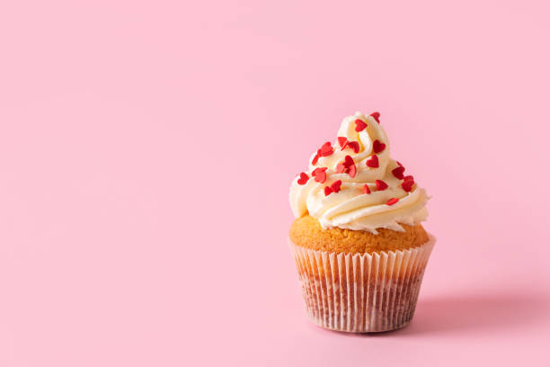 istock Vanilla cupcakes close up on with confectionery sprinkles 1425145988