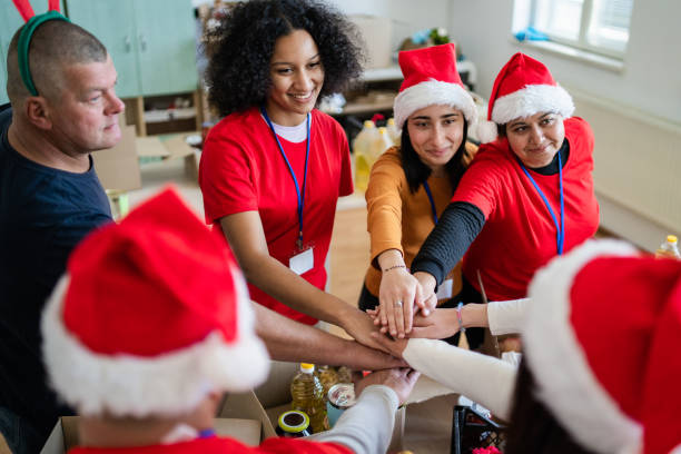 istock Happy volunteers with team building exercise 1425147029