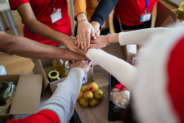 istock A circle of stacked hands on outstretched arms 1425147031