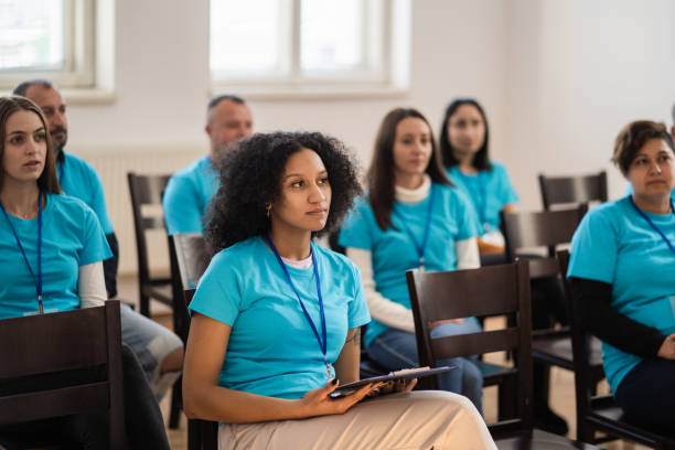 istock Serious young adults attending a seminar 1425147085
