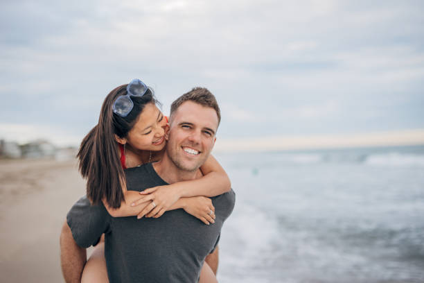 istock Multi ethnic couple man holds on hands beautiful woman 1425148379