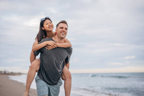 istock Multi ethnic couple man holds on hands beautiful woman 1425149278