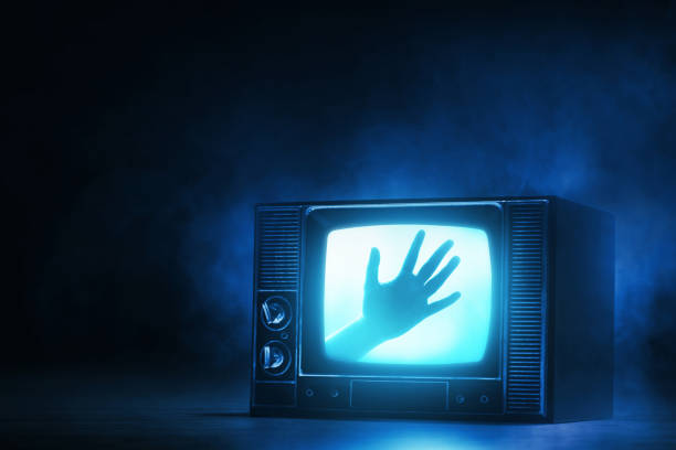 istock Watching horror movie on tv 1425150055