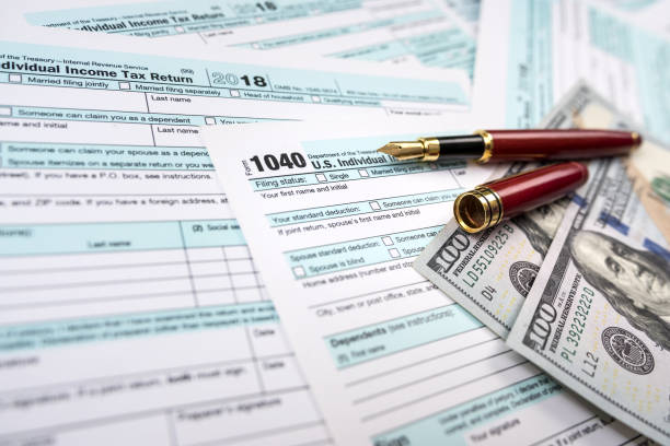 istock top view of documents with important date april filing declaration. 1425153051