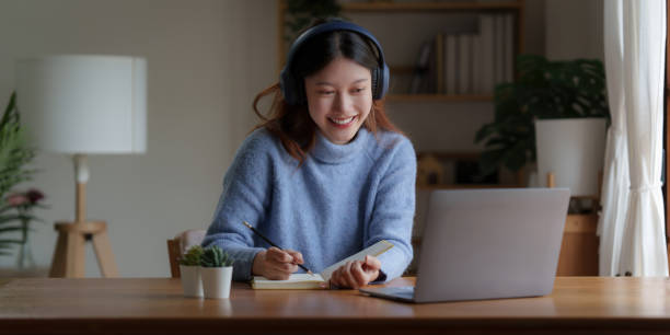 istock Young college student have question and answer to teacher by video call E-learning, online, education concept 1425153079