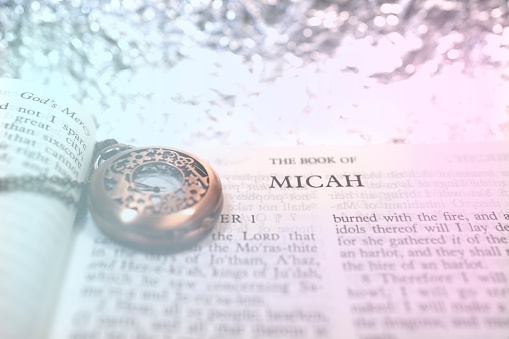 Open book Holy Bible The Book of MICAH for background blur bokeh and inspiration