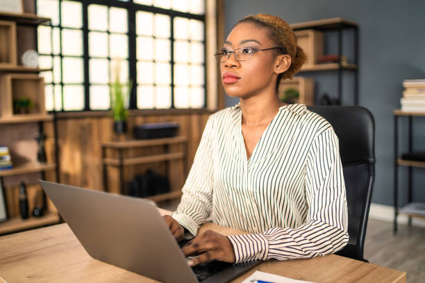 istock A secretary staring into the distance at work 1425154103