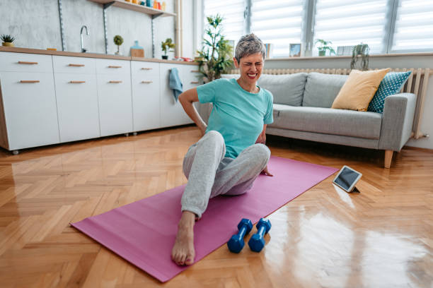 istock Senior Woman Having Back Pain While Working Out At Home 1425157113