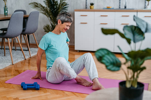 istock Senior Woman Having Back Pain While Working Out At Home 1425157248