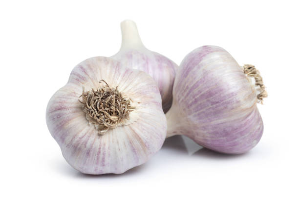 istock Raw whole garlic isolated on white background. Full depth of field. 1425157780
