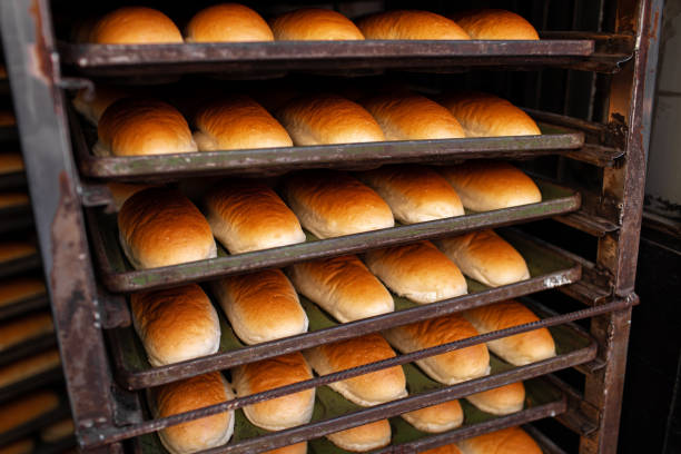 istock Freshly baked bread loafs on a shelf 1425158174