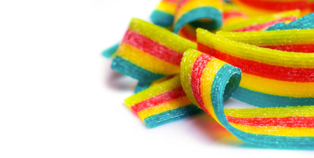 istock rainbow sour jelly candies strips in sugar sprinkle on white background 1425158441