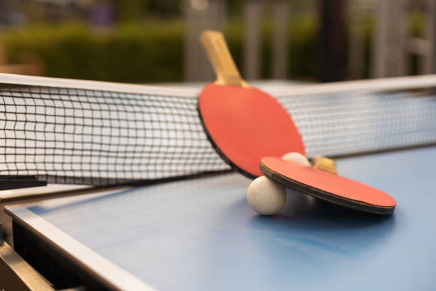 istock Ping pong table, rackets and balls in a sport hall 1425159340
