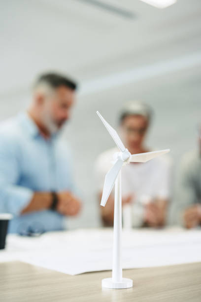 istock Group of engineers working on a wind turbine project 1425159873
