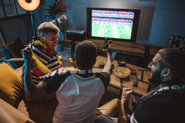 istock Watching soccer championship at home 1425166271