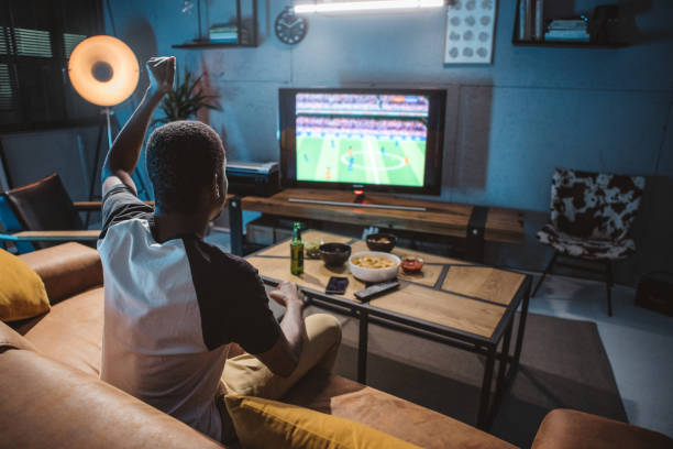 istock Watching soccer game at home 1425166287