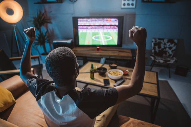 istock Watching soccer game at home 1425166288