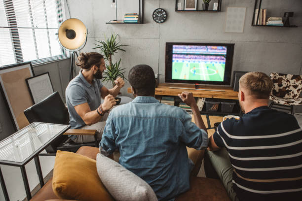 istock Watching soccer championship at home 1425166623