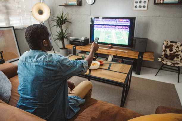 istock Watching soccer game at home 1425166738