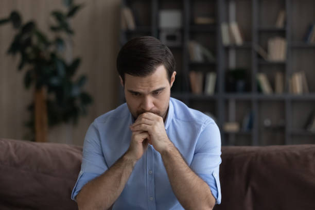 istock Confused unhappy young man lost in negative thoughts. 1425167362